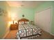 The carpeted bedroom is painted a calming light green and has a ceiling fan at 170 Glenwood Dr., Conway, SC 29526
