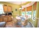 Bright breakfast nook features a table, four chairs, and a large window letting in plenty of natural light at 170 Glenwood Dr., Conway, SC 29526