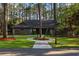 Beautifully landscaped front yard with a long circular driveway and mature trees at 170 Glenwood Dr., Conway, SC 29526