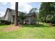 Charming home exterior with a well-maintained lawn and mature trees at 170 Glenwood Dr., Conway, SC 29526