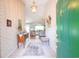 Open foyer showcasing tiled floors, decorative wallpaper and flows into a living space at 170 Glenwood Dr., Conway, SC 29526