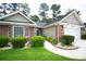 Charming one-story home with brick accents, manicured shrubs, and a well-maintained lawn at 170 Glenwood Dr., Conway, SC 29526