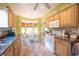 Bright kitchen featuring wood cabinets, tiled backsplash, and an adjacent breakfast nook at 170 Glenwood Dr., Conway, SC 29526