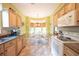 Charming kitchen features wooden cabinets, tiled backsplash, and an adjacent breakfast nook at 170 Glenwood Dr., Conway, SC 29526