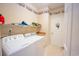 Well-lit laundry room features a side-by-side washer and dryer and ample shelving at 170 Glenwood Dr., Conway, SC 29526