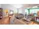 Inviting living room with wood floors, comfortable seating, and views of the nearby dining area at 170 Glenwood Dr., Conway, SC 29526