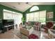 Sun room featuring vaulted ceilings, lots of windows, and cozy seating overlooking an adjacent room at 170 Glenwood Dr., Conway, SC 29526