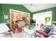 Bright sun room with vaulted ceilings, comfortable seating, and view to living room with a traditional decor at 170 Glenwood Dr., Conway, SC 29526