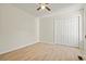 Bedroom with wood-look flooring and double door closet at 1763 Lipscomb Rd., Mullins, SC 29574