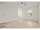Bright bedroom features neutral walls, wood-look flooring, and ceiling fan at 1763 Lipscomb Rd., Mullins, SC 29574