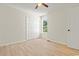 Bedroom featuring wood-look flooring, closet, and bright window at 1763 Lipscomb Rd., Mullins, SC 29574