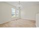 Bright dining room featuring light wood floors, and a stylish chandelier at 1763 Lipscomb Rd., Mullins, SC 29574