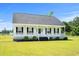 Classic single-story home with a covered front porch, perfect for enjoying the outdoors at 1763 Lipscomb Rd., Mullins, SC 29574