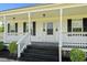 Welcoming front porch with white columns and black shutters, adding to the home's curb appeal at 1763 Lipscomb Rd., Mullins, SC 29574