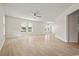 Bright and open living room features light wood floors and several windows for ample natural light at 1763 Lipscomb Rd., Mullins, SC 29574