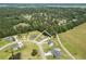 Aerial view of the home in a wooded community, featuring a private pool and spacious lot at 193 Field Loop Rd., Georgetown, SC 29440