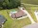 Stunning aerial view of the property featuring a private pool, spacious yard, and detached garage at 193 Field Loop Rd., Georgetown, SC 29440