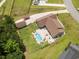 Aerial view showcasing the home's backyard with a pool, patio, and detached garage at 193 Field Loop Rd., Georgetown, SC 29440