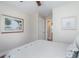 Bright bedroom showcasing art-filled walls and a cozy bed with comfortable decor and natural light at 193 Field Loop Rd., Georgetown, SC 29440