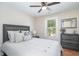 Comfortable bedroom featuring neutral tones, a soft bed, and a window providing natural light at 193 Field Loop Rd., Georgetown, SC 29440