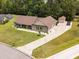 Well-maintained home with a long driveway, manicured lawn, and a detached garage at 193 Field Loop Rd., Georgetown, SC 29440
