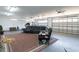 Spacious garage setup as living area with comfortable furniture, a rug, and ample space at 193 Field Loop Rd., Georgetown, SC 29440