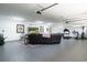 Large garage used as living area with lounge, TV, decor, and exercise equipment at 193 Field Loop Rd., Georgetown, SC 29440