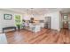 Modern kitchen with white cabinetry, stainless steel appliances, granite countertops, and a breakfast bar with seating at 193 Field Loop Rd., Georgetown, SC 29440