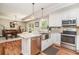 Modern kitchen featuring granite countertops, stainless steel appliances, and white cabinetry, perfect for cooking and entertaining at 193 Field Loop Rd., Georgetown, SC 29440