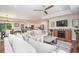 Bright living room showcases a comfortable seating arrangement, an entertainment center, and an open view to the kitchen at 193 Field Loop Rd., Georgetown, SC 29440