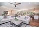 Spacious living room with open layout, stylish furnishings, and seamless flow to dining and kitchen areas for modern living at 193 Field Loop Rd., Georgetown, SC 29440