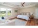 Relaxing main bedroom featuring a comfortable bed, a ceiling fan, and ample natural light, creating a serene retreat at 193 Field Loop Rd., Georgetown, SC 29440