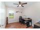 Charming home office with wood floors, a window, and a desk perfect for working at home at 193 Field Loop Rd., Georgetown, SC 29440