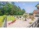 Inviting pool area surrounded by trees, lounge chairs, and dining set for outdoor enjoyment at 193 Field Loop Rd., Georgetown, SC 29440