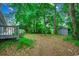 Backyard with wooden deck and lush landscaping, offering a private and peaceful outdoor space at 2010 Ye Olde Kings Hwy., North Myrtle Beach, SC 29582