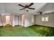 Spacious bedroom with adjoining bathroom, built-in shelves and dual ceiling fans at 2010 Ye Olde Kings Hwy., North Myrtle Beach, SC 29582