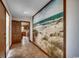 Hallway highlighted by a decorative mural, tile flooring, and access to other rooms at 2010 Ye Olde Kings Hwy., North Myrtle Beach, SC 29582