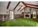Living room with stone fireplace, wood paneling and beams, offering a warm and inviting space at 2010 Ye Olde Kings Hwy., North Myrtle Beach, SC 29582