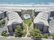 Stunning aerial view of an oceanfront condo community with a central pool and beach access at 206 2Nd Ave. N # 271, North Myrtle Beach, SC 29582