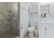 Bright bathroom with a tiled shower, white cabinets, and modern fixtures at 206 2Nd Ave. N # 271, North Myrtle Beach, SC 29582