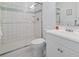 Updated bathroom features tiled shower, white vanity, and neutral color palette at 206 2Nd Ave. N # 271, North Myrtle Beach, SC 29582