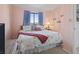 Comfortable bedroom with a patterned comforter, blue curtains, and a bright view at 206 2Nd Ave. N # 271, North Myrtle Beach, SC 29582