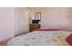 Bedroom showcases a soft decor, TV, dresser, and a comfortable, patterned bedspread at 206 2Nd Ave. N # 271, North Myrtle Beach, SC 29582