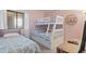 Inviting bedroom featuring a twin bed and bunk beds with beach themed bedding at 206 2Nd Ave. N # 271, North Myrtle Beach, SC 29582