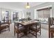 Bright dining room with seating for six, a sun-filled window nook, and seamless access to the outdoor patio at 206 2Nd Ave. N # 271, North Myrtle Beach, SC 29582