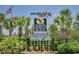 Welcome to North Myrtle Beach sign, surrounded by lush landscaping and palm trees at 206 2Nd Ave. N # 271, North Myrtle Beach, SC 29582