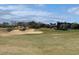 Scenic golf course view, with a large sand trap and a clubhouse in the background at 206 2Nd Ave. N # 271, North Myrtle Beach, SC 29582