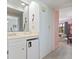 Hallway with a wet bar leading to the bedroom with neutral color scheme at 206 2Nd Ave. N # 271, North Myrtle Beach, SC 29582