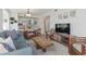 Open-concept living space with a dining area, lounge, and kitchen featuring modern appliances at 206 2Nd Ave. N # 271, North Myrtle Beach, SC 29582