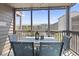 Relaxing outdoor patio with seating for four, perfect for enjoying meals while overlooking the community at 206 2Nd Ave. N # 271, North Myrtle Beach, SC 29582